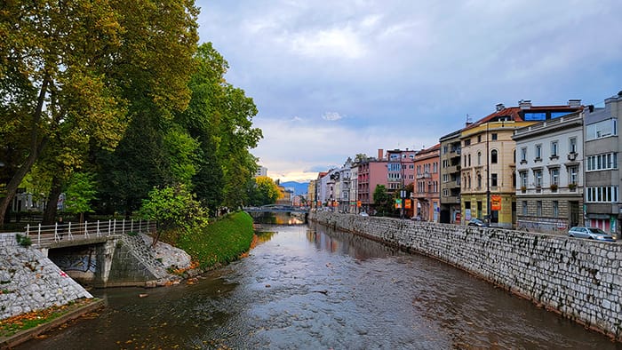 view of the buildings lining the Miljacka River, a common sight when you visit Sarajevo