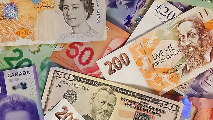 accessing money while traveling image of currency to show travel preparations for international travel