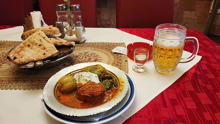 picture of dolmas, beer, and fruit brandy, a must when you visit Sarajevo