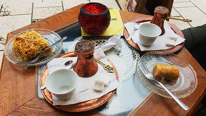traditional Balkan food dishes of baklava and Bosnian coffee