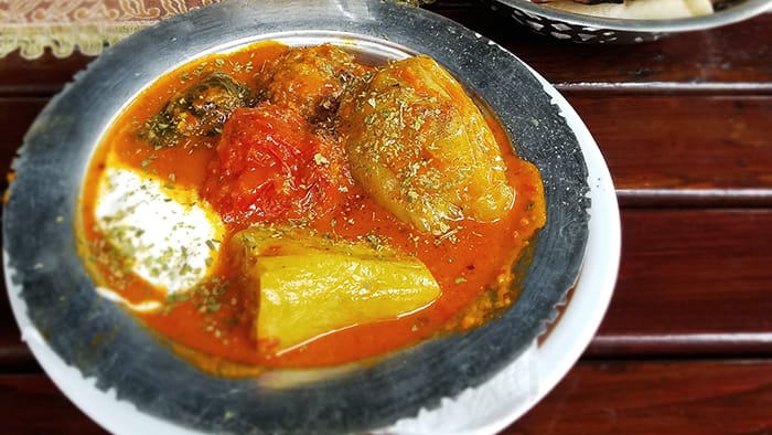 Balkan food dolmas picture of stuffed vegetables in sauce