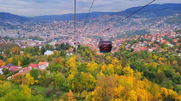 image of fall colors on the trees surrounding the city of Sarajevo, Bosnia & Herzegovina