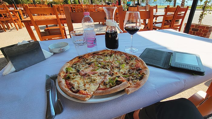 pizza and wine in Vlore Picture of a pizza and carafe of wine with the Adriatic Sea in the background
